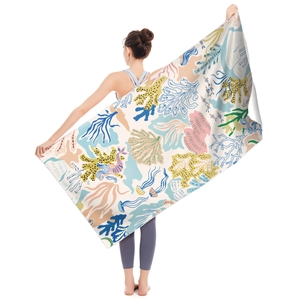Microfiber beach towel featuring vibrant coral reef and ocean life illustration