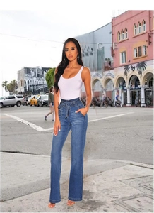 Close-up detail of high waist blue denim pants with stylish bow tie belt and straight leg cut