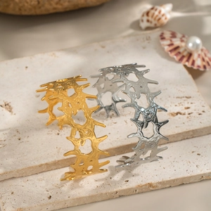 Textured thorn cuff bracelet in 18K gold and silver plating on stone base