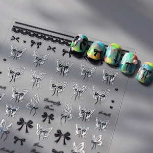 Thin butterfly and bow nail decals with silver reflective patterns for professional manicure