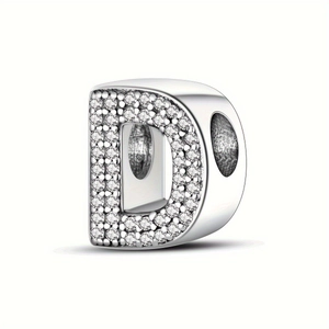 Close-up of silver letter D charm bead with sparkling pavé crystals and large core hole