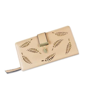 Detail of laser-cut leaf pattern on beige long wallet with golden leaf charm puller