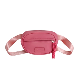 Pink minimalist kids waist bag in smooth synthetic leather with woven shoulder strap