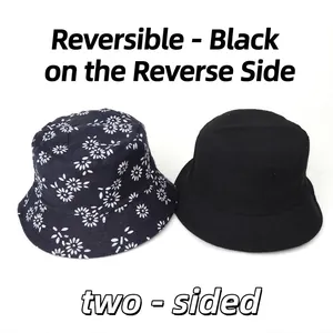 Reversible cotton bucket hat with white daisy floral print and solid black reverse side