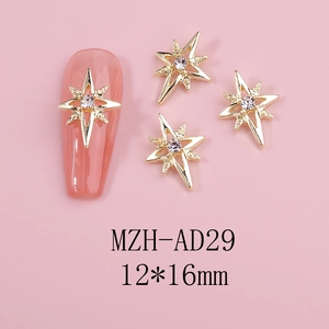 Detail of 12x16mm gold alloy star nail charms with crystal center on pink base