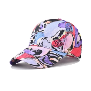 Detail shot of the cotton baseball cap with vibrant abstract graffiti and colorful print