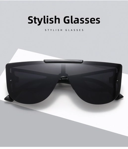 Close-up of sleek black rimless oversized shield sunglasses with 62-16 size specifications