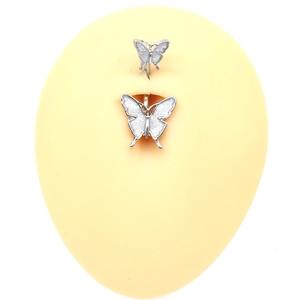 Silver butterfly belly button ring with iridescent white glitter wings on silicone model