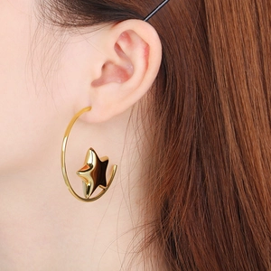 Close-up of elegant 18k gold-plated large C-shaped hoop earrings with star charms