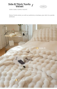 Detail of thick creamy double-sided faux fur blanket with 3D spherical texture and soft feel