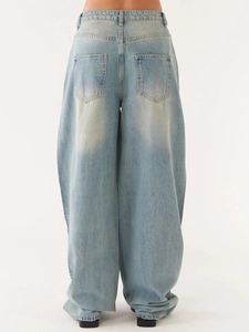 Back view of women's light blue baggy denim jeans with wide leg and high waist fit