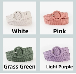 Close-up of round buckle braided belts in white, pink, green and purple colors
