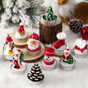 Christmas themed paraffin wax candles set featuring Santa Claus and Snowman shapes