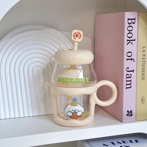 Close-up of cute cartoon puppy glass cup with beige straw and nice day lettering