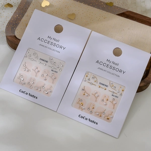 Sparkling crystal nail art stickers with gold and silver heart charms in jewelry set