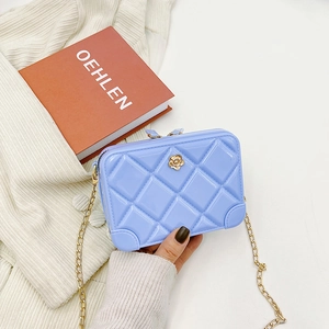 Quilted lavender PVC jelly bag with gold chain strap and floral accent for girls