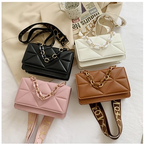 Flat lay of small chain square bags in four colors with quilted patterns and acrylic handles