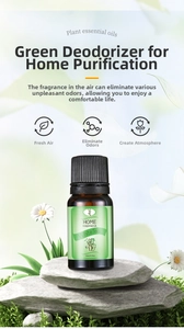 White Tea essential oil bottle on flat stones surrounded by white daisies and greenery
