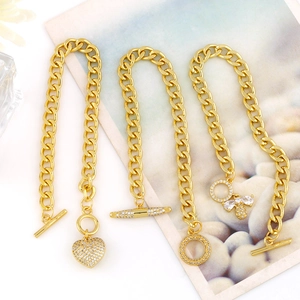Gold Cuban chain bracelets set featuring heart pendant bee charm and OT clasp design