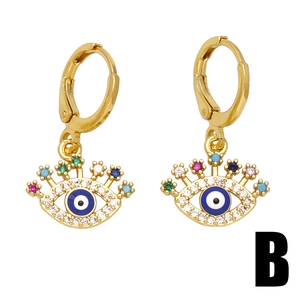 Golden Evil Eye hoop earrings with colorful gemstone eyelashes on a white background