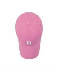 Close-up top view of pink cotton baseball cap with white 3D embroidered R letter