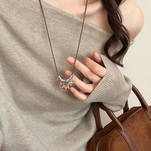Vintage wooden horse pendant necklace on brown cord with silver rings for women