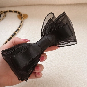 Elegant double-layered black mesh and satin bow banana clip for a sweet high ponytail