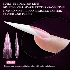 Macro detail of OM-05 stiletto nail forms with built-in locator lines for gel extension