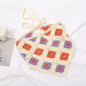 Detail of bohemian crochet halter top with colorful vintage knitted square patterns