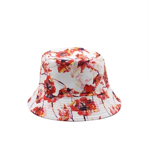 Detail of a white canvas bucket hat with red and orange 3D floral prints for sun protection