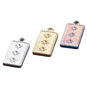 Three rectangular stainless steel pendants in gold, silver, and rainbow with star engraving