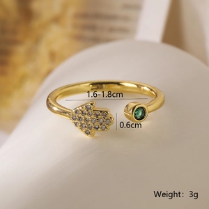Detailed size view of Fatima Hand open ring with zircon and green gemstone