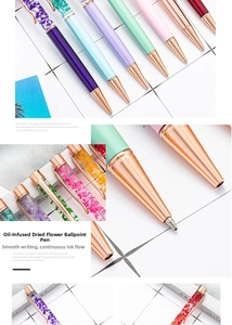 Detail of oil-filled pens with colorful dried flowers and rose gold metal trim