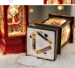Detail view showing bottom battery compartment for LED Christmas snow globe lanterns
