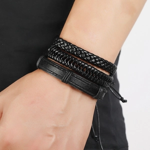 Multi-layer black braided leather bracelet set for men shown on a male wrist