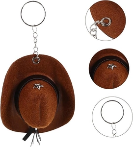 Detail view of mini brown cowboy hat keychain with star ornament and metal ring