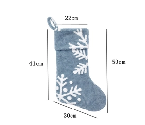 Detailed dimension chart of blue Christmas stocking with white snowflake patterns