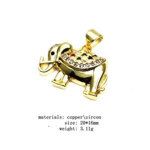 Golden elephant pendant necklace with micro-pave zircons on a white background