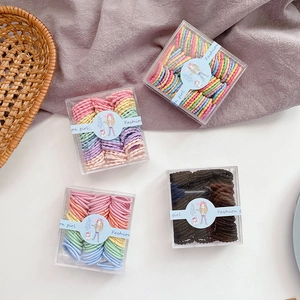 80-piece pack of candy-colored kids elastic hair ties in clear square gift boxes
