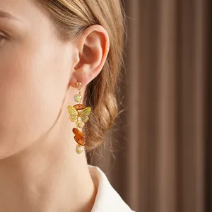 Vintage gold butterfly tassel earrings with crystal beads and elegant dangling charms