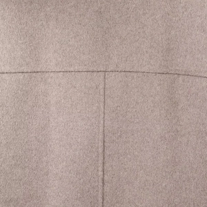 Macro view of light camel wool blend fabric with soft texture and T-stitching detail