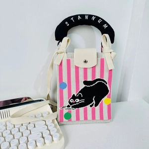 Pink striped knit phone bag with cartoon cat pattern and black padded top handle