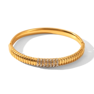 Detailed macro view of 18k gold plated stainless steel bracelet with rhinestone inlay