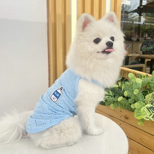 Close-up of breathable blue mesh puppy vest with H2O embroidery on a white dog