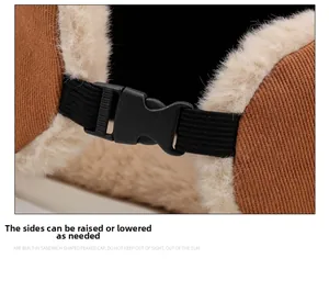 Detailed close-up of a brown winter hat with adjustable buckle and warm beige faux fur lining
