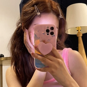 Pink mirror finish phone case with a heart-shaped pop socket for three-camera smartphones