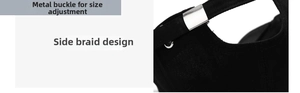 Detail of black cotton baseball cap showing metal adjustable buckle and side braid design
