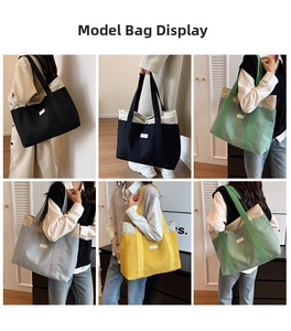 Detail of color-blocked canvas tote bags showing reinforced straps and spacious design