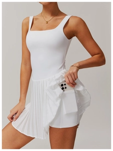 Detail showing hidden side pocket on white pleated tennis dress for phone storage