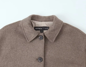 Detail of wool blend coat collar and buttons with MYST&ZA brand label in dark brown